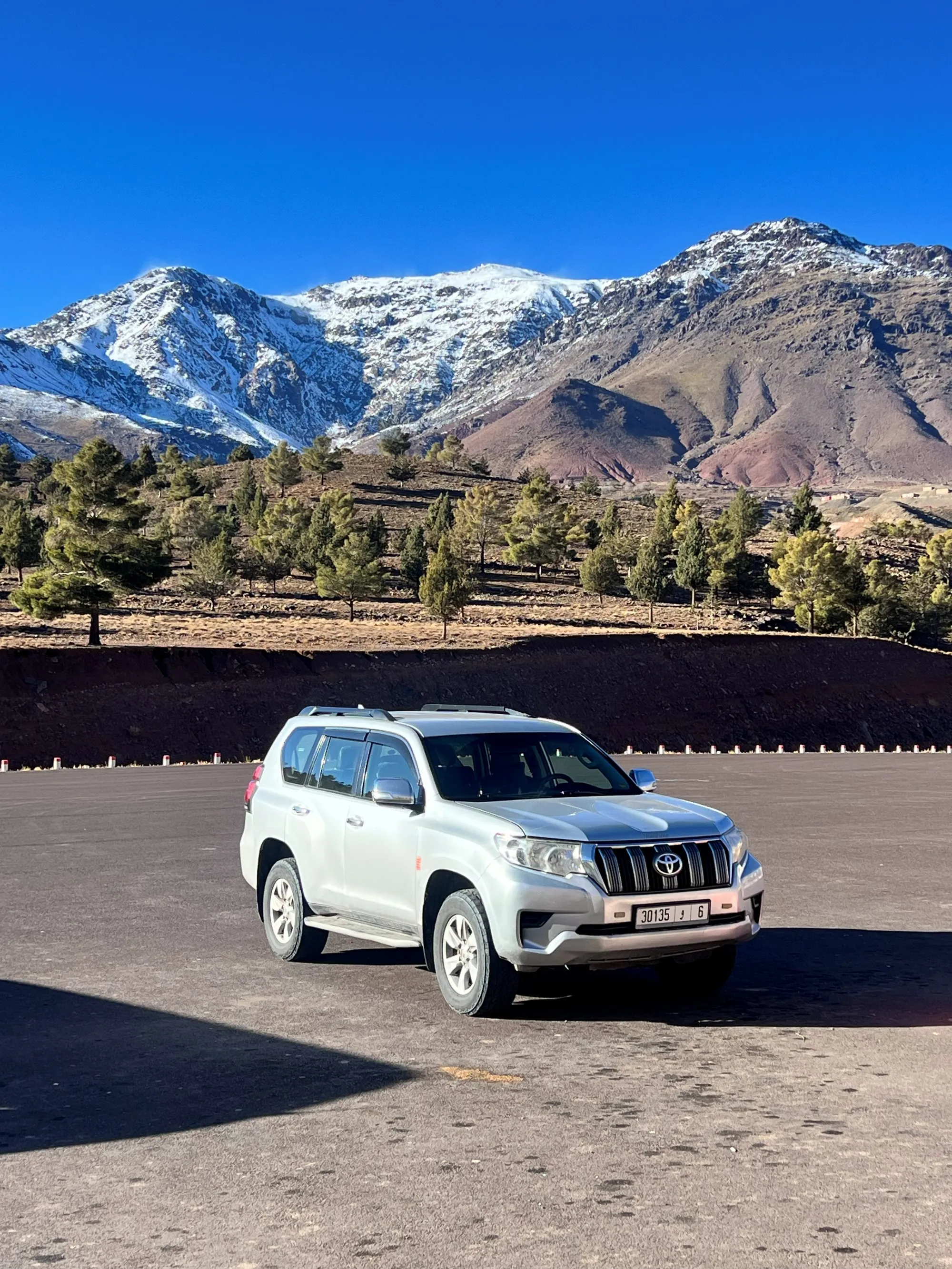 A private 4x4 on a snowy High Atlas mountain pass
