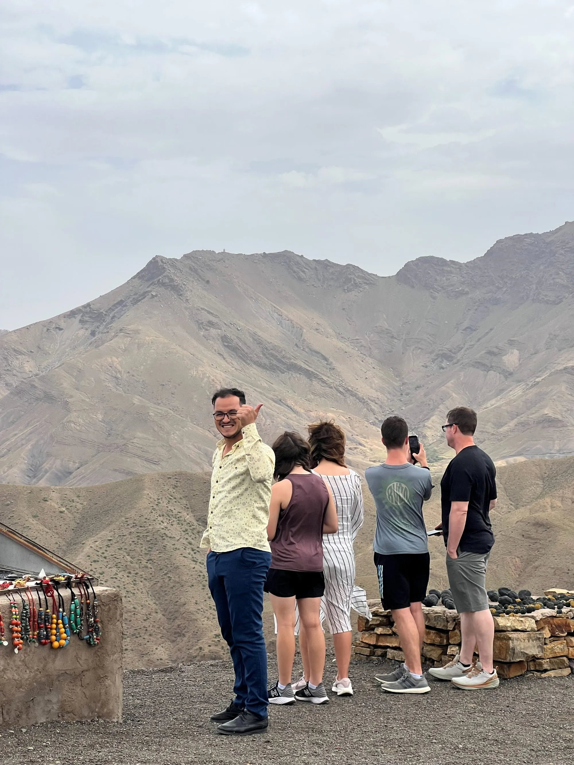 Happy guests at a mountain viewpoint with Local Desert Tours